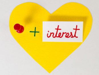 yellow heart with "+ interest" text