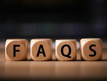 wooden cubes spelling out "FAQS"