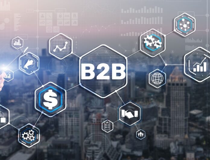 Graphic over a skyline with “B2B” in a center hex and multiple hexes branching out from it.