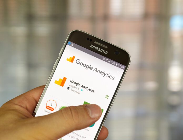 A smartphone with a Google Analytics screen open.