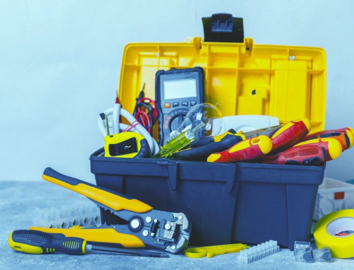 An electrician's toolbox and tools.